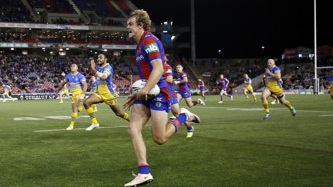 Cory Denniss of the Knights sprints down the wing to set up a Knights try during the round 12 NRL match between the Newcastle Knights and the Parramatta Eels at Hunter Stadium in Newcastle, Monday, May 30, 2016. (AAP Image/Darren Pateman)