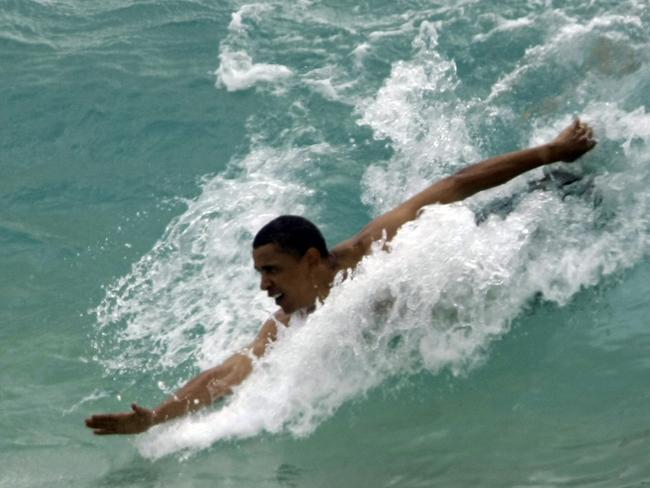 Wave of diplomacy … Barack Obama will be able to upgrade from body surfing to longboard surfing after he meets Tony Abbott in Washington today. Picture: AP/Alex Brandon