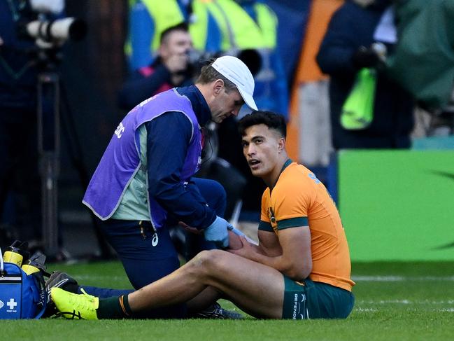 EDINBURGH, SCOTLAND - NOVEMBER 24: Joseph-Aukuso Suaalii of Australia reacts as he receives medical treatment after sustaining an injury, before later leaving the field, during the Autumn Nations Series 2024 match between Scotland and Australia at Scottish Gas Murrayfield on November 24, 2024 in Edinburgh, Scotland. (Photo by Stu Forster/Getty Images)