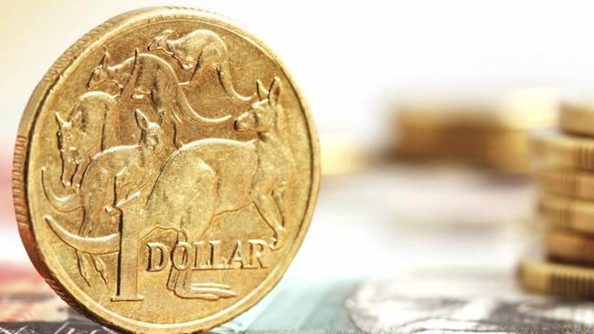 Aussie one dollar coins, on a twenty dollar note.