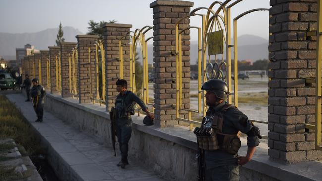 Afghan security personnel stand guard near the site of suicide bomb attack on the proximity of the Alokozay Kabul International cricket ground in Kabul. Picture: AFP PHOTO / WAKIL KOHSAR