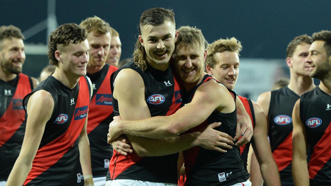 LAUNCESTON, AUSTRALIA - JUNE 20: Dyson Heppell and Sam Draper of the Bombers celebrate the win during the round 14 AFL match between the Hawthorn Hawks and the Essendon Bombers at University of Tasmania Stadium on June 20, 2021 in Launceston, Australia. (Photo by Steve Bell/Getty Images)