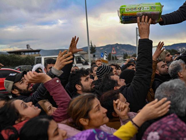 Earthquake survivors gather to collect supplies at a diaper distribution in Hatay. Picture: AFP