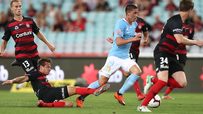 Lachlan Wales of Melbourne City threads his way through the Wanderers defence. Picture: Getty Images