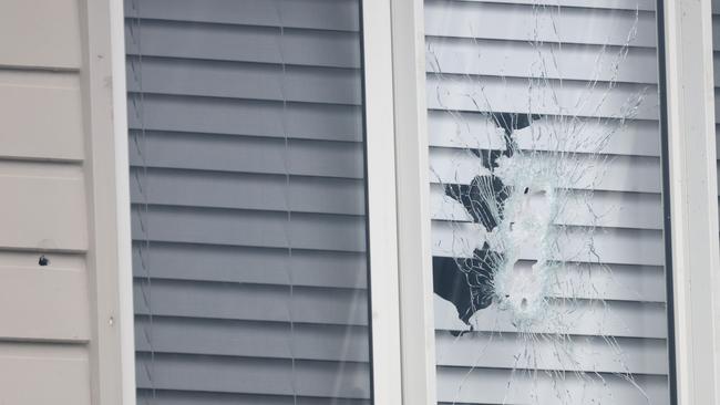 A close up of the bullet holes in a house on Steeple Pl in Marsden Park after a drive by shooting last night. Picture: NewsWire / Damian Shaw