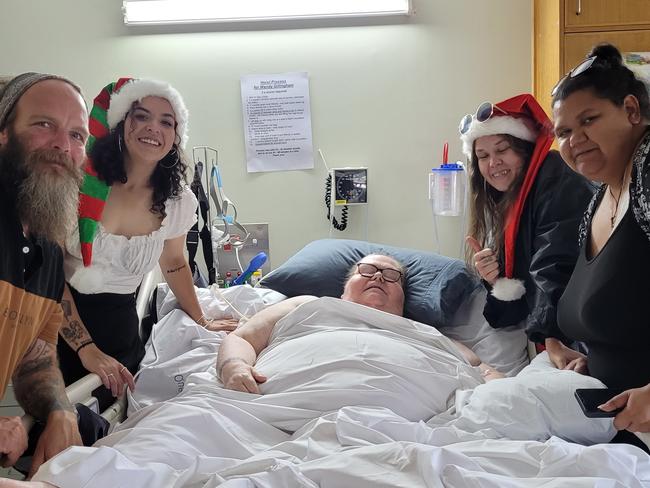 Wendy Gillingham-Scott surrounded by her husband Mick and their three daughters at Christmas.