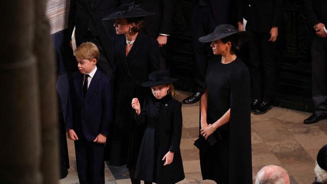 Catherine, Princess of Wales, pictured with her children George and Charlotte and Meghan Markle. Picture: Phil Noble / POOL / AFP