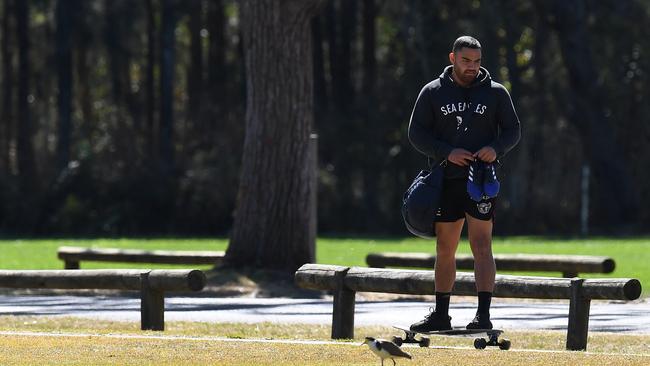 Walker rides his skateboard to Manly training. (AAP Image/Dean Lewins)