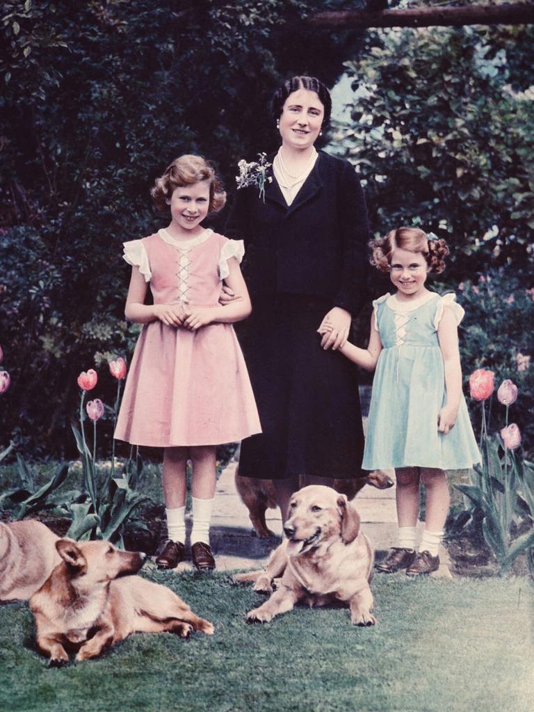 The Duchess of York poses with her daughters Elizabeth and Margaret in the garden of the Royal Lodge at Windsor in June 1936, just a few months after the death of King George V, which saw Elizabeth’s uncle take the throne as King Edward VIII. Picture: Hulton/Archive