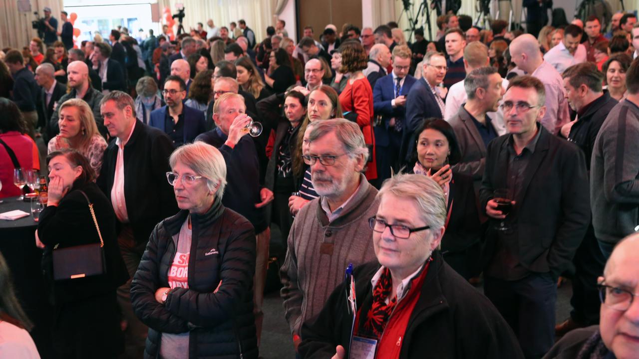 Labor supporters watch the tally count in Melbourne. Picture: David Crosling