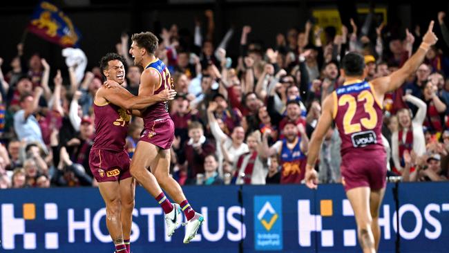 Zac Bailey celebrates with Cam Rayner after kicking a goal in the first quarter against Port Adelaide. Picture: Bradley Kanaris/Getty Images