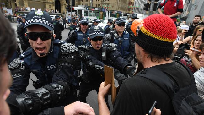 Police officers clash with protestors at the demonstration. Picture: AAP Image/James Ross