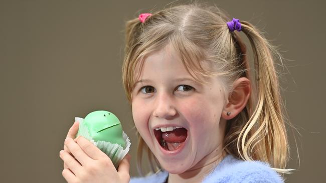 8-year-old Holly Stanley about to tuck into an iconic Balfours green frog cake. Picture: Keryn Stevens