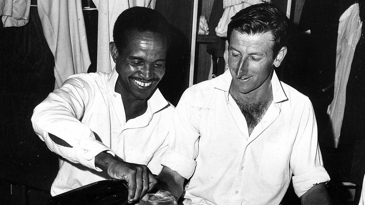 Sobers and Lawry share a drink in the rooms at the MCG after the 1968 Boxing Day Test.