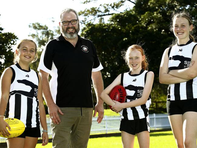 Club president Simon Tracy with Margot Bass-Tracy and Francie and Emma Walsh. Picture: John Appleyard