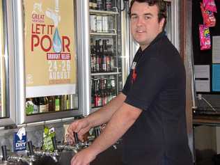 LET IT POUR: Callum Allery serves up another beer at the Kingaroy Hotel raising money for drought relief. Picture: Matt Collins