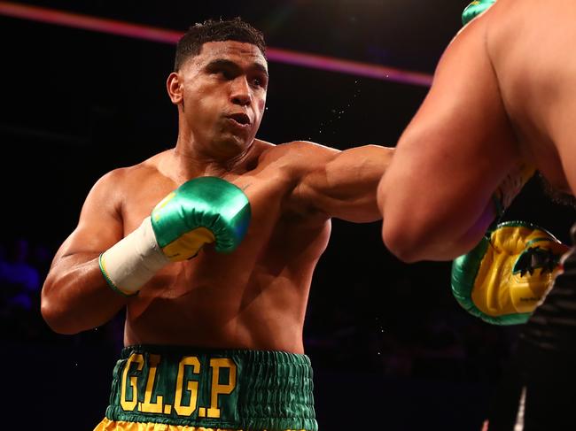 BRISBANE, AUSTRALIA - DECEMBER 04: Tevita Pangai Jr punches Gerico Cecil during the Heavyweight bout at Fortitude Music Hall on December 04, 2021 in Brisbane, Australia. (Photo by Chris Hyde/Getty Images)