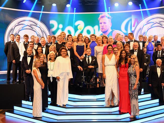 Dylan Alcott poses with past and present Australian tennis players after winning the Newcombe Medal at the 2016 Newcombe Medal