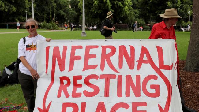 Protesters in Hyde park across the road from St Mary's Cathedral in Sydney as a requiem mass service is held for late controversial Cardinal George Pell. Picture: NCA NewsWire / Damian Shaw