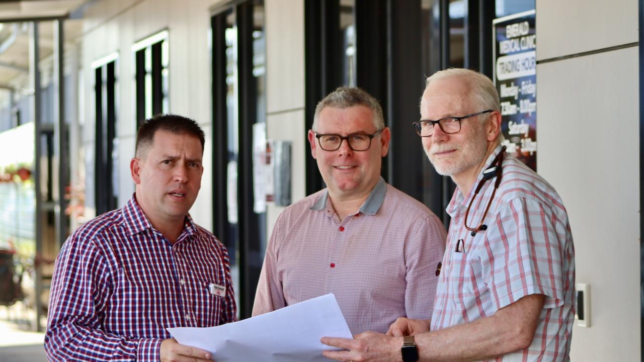 Labor candidate for Flynn, Matt Burnett, Senator Murray Watt, and the head of the General Practitioners Superclinic, Dr Ewen McPhee.