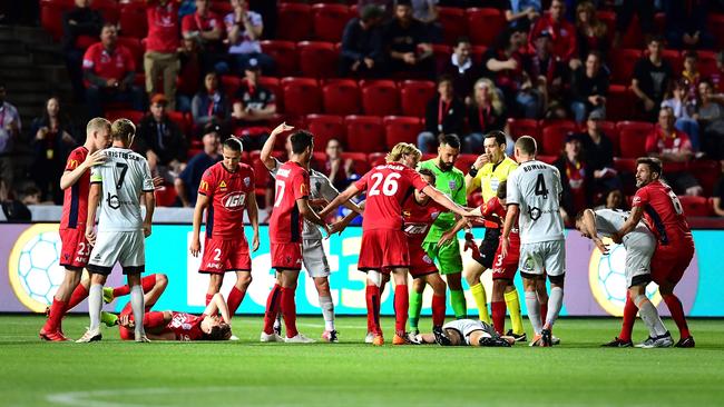 Brisbane Roar’s Stefan Mauk lies unconscious after colliding with Craig Goodwin of Adelaide late on in the game at Coopers Stadium. Picture: Getty Images