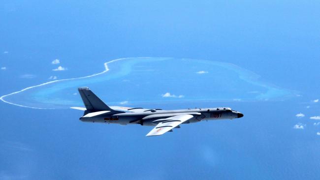 A Chinese H-6K bomber patrols the islands and reefs in the South China Sea, another potential flashpoint this year. Picture: Liu Rui/Xinhua/AP