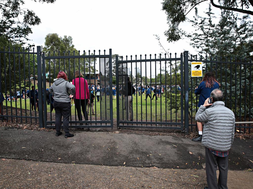 Parents wait outside Castle Hill High School in 2020. Picture: Adam Yip