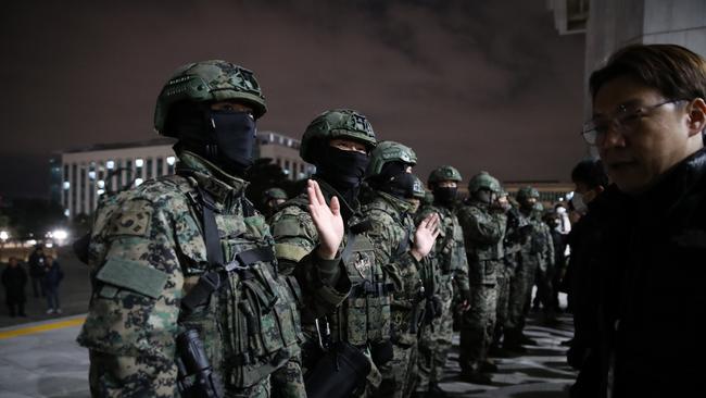 South Korean soldiers try get into the national assembly in Seoul, South Korea.