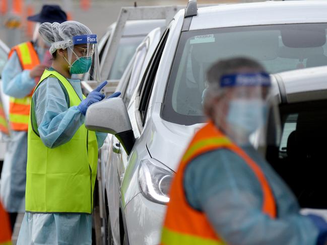 People queue at the COVID testing station at Shepparton Sports Centre. Picture: Andrew Henshaw