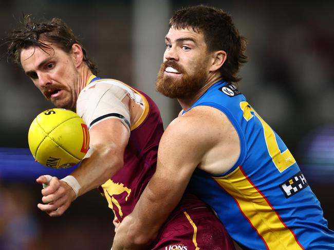 BRISBANE, AUSTRALIA - MAY 05: Joe Daniher of the Lions and Sam Collins of the Suns compete for the ball during the round eight AFL match between Brisbane Lions and Gold Coast Suns at The Gabba, on May 05, 2024, in Brisbane, Australia. (Photo by Chris Hyde/AFL Photos/via Getty Images )