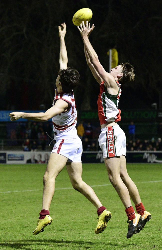 Henley High School's Jack Lukosius and Prince Alfred College's Seb Quaini, at the State knockout football final at Norwood Oval. Picture: Bianca De Marchi