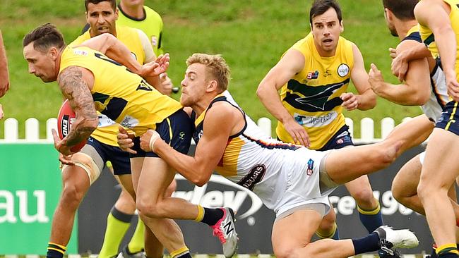 Adelaide's Hugh Greenwood tackles Eagles' James Boyd in the SANFL on Saturday. Picture: Tom Huntley