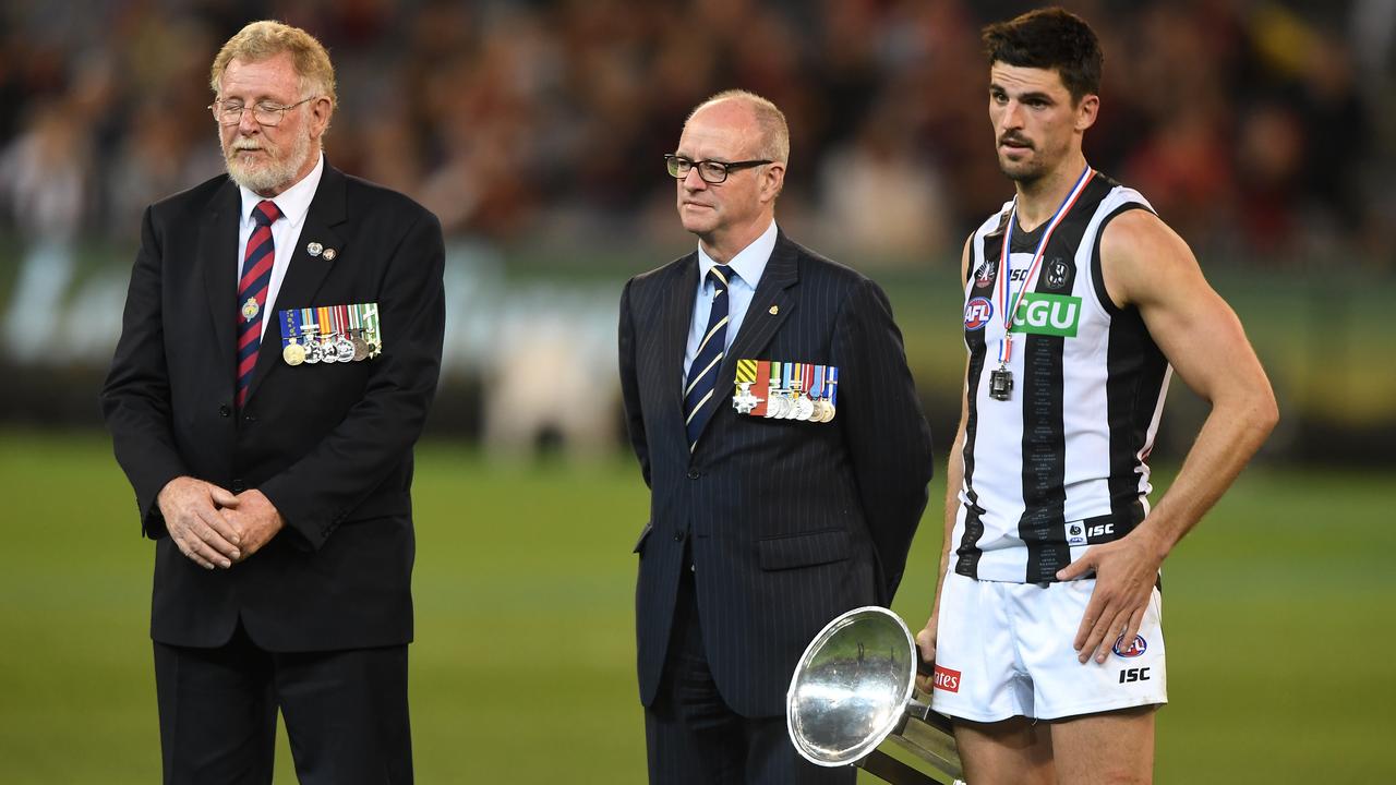 Scott Pendlebury during the Anzac Day Medal ceremony, during which boos rained down from Essendon fans. (AAP Image/Julian Smith)
