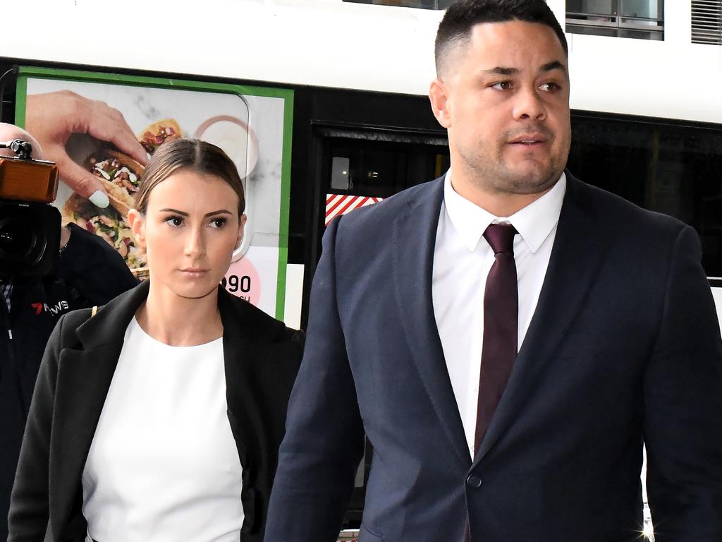 Jarryd Hayne with his wife beside him.