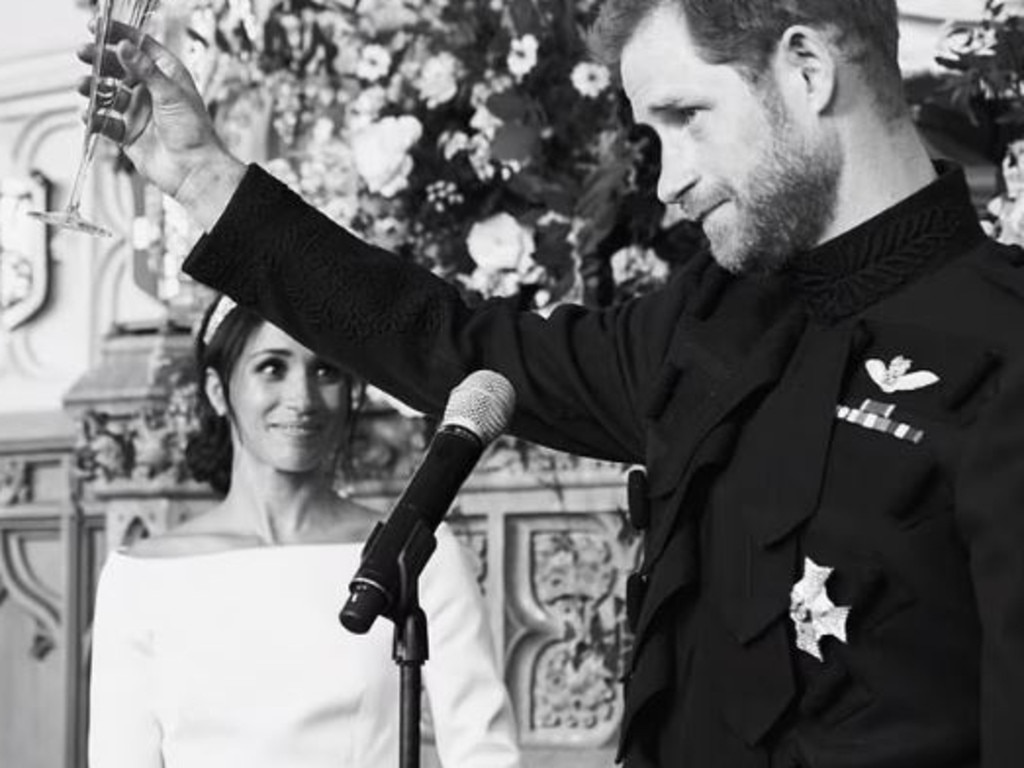 Prince Harry raises a toast at his wedding to Meghan Markle as the Duchess of Sussex watches on. Picture: Netflix