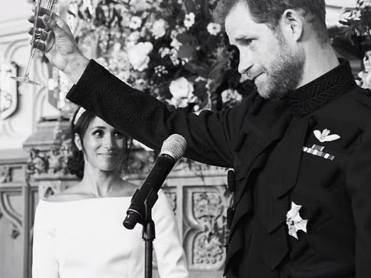Prince Harry raises a toast at his wedding to Meghan Markle as the Duchess of Sussex watches on. Picture: Netflix