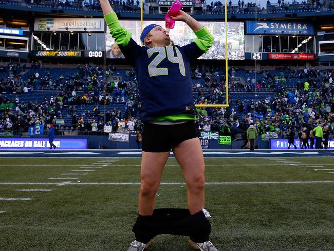SEATTLE, WA - JANUARY 18: A Seattle Seahawks fan celebrates after the Seahawks defeated the Green Bay Packers in the 2015 NFC Championship game at CenturyLink Field on January 18, 2015 in Seattle, Washington. Tom Pennington/Getty Images/AFP == FOR NEWSPAPERS, INTERNET, TELCOS & TELEVISION USE ONLY ==