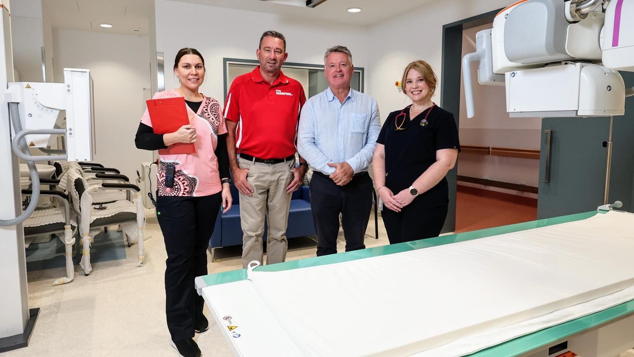 The $26.4m Cairns Hospital emergency department expansion at the Cairns Hospital was completed in August, with six additional beds, a dedicated ED X-ray suite, new acute care rooms and upgraded resuscitation bays now being used by emergency patients. Cairns Hospital emergency department clinical nurse Lerisa Simpson-Harris, Member for Barron River Craig Crawford, Member for Cairns Michael Healy and clinical nurse Sharnee Dalglish inspect the emergency department's new X-ray suite. Picture: Brendan Radke