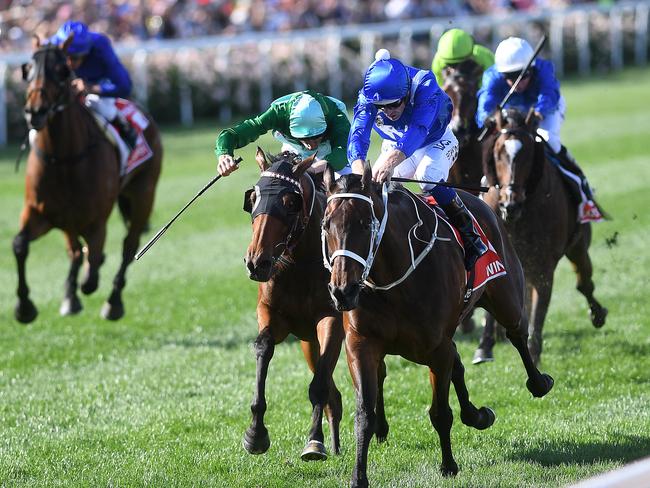 Winx (third from left) holds out the fast-finishing Humidor. Picture: AAP