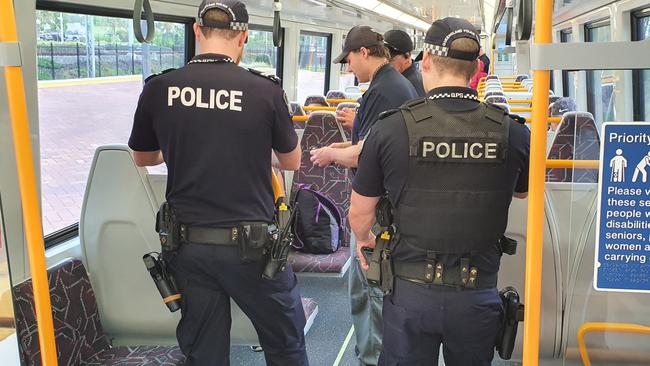 Police on a train at Coomera Station as part of Operation Sierra Luminous in January.