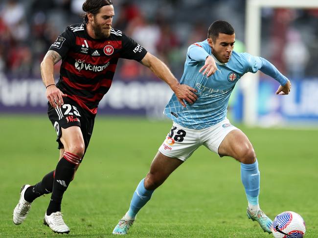 Harry Politidis (right) of City runs the ball under pressure from Josh Brillante (left) of the Wanderers during the A-League Men round 25 match between Western Sydney Wanderers and Melbourne City at CommBank Stadium, on April 20, 2024, in Sydney, Australia. (Photo by Mark Kolbe/Getty Images)