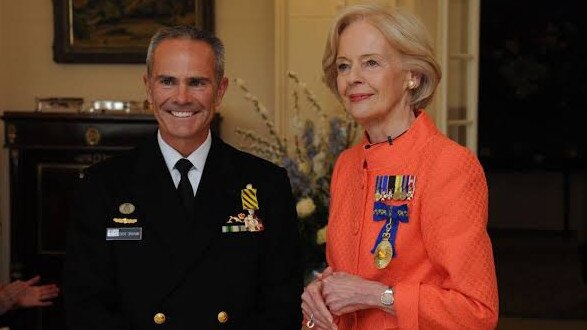 David Graham (left) a top former naval officer, has been found guilty of a string of child sex offences. He is pictured being presented with the Conspicuous Service Cross. PICTURE: Royal Australian Navy/Supplied