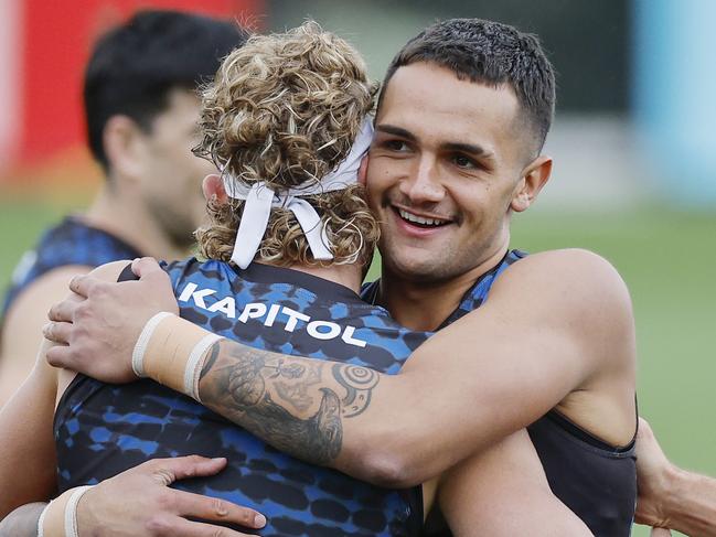 NCA. MELBOURNE, AUSTRALIA. 19th February, 2025 . Western Bulldogs training at the Whitten Oval.   Bulldog Jamarra Ugle-Hagan hugs  Aaron Naughton at training today   .  Picture: Michael Klein