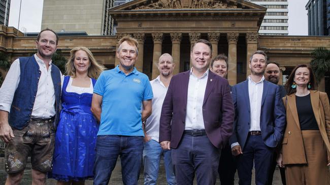 Lord Mayor Adrian Schrinner, centre, with Brisbane business and daylight saving advocates Boris and Kim Zoulek, John Sharpe, Andrew Baturo, Damien Prosser, Jayden Bryant, Steven Bradbury and Kate Gould in King George Square on Sunday. Picture Lachie Millard