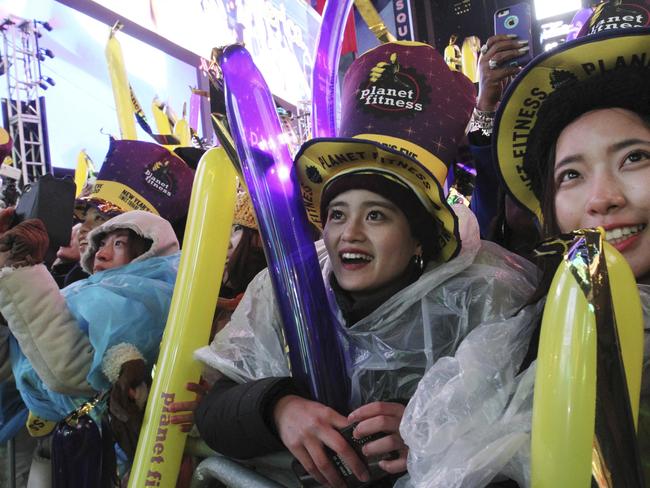 Revellers dressed for the rain in Times Square. Picture: AP