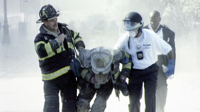 Louie Cacchili saving a fire chief as they leave the Twin Towers after the collapse.