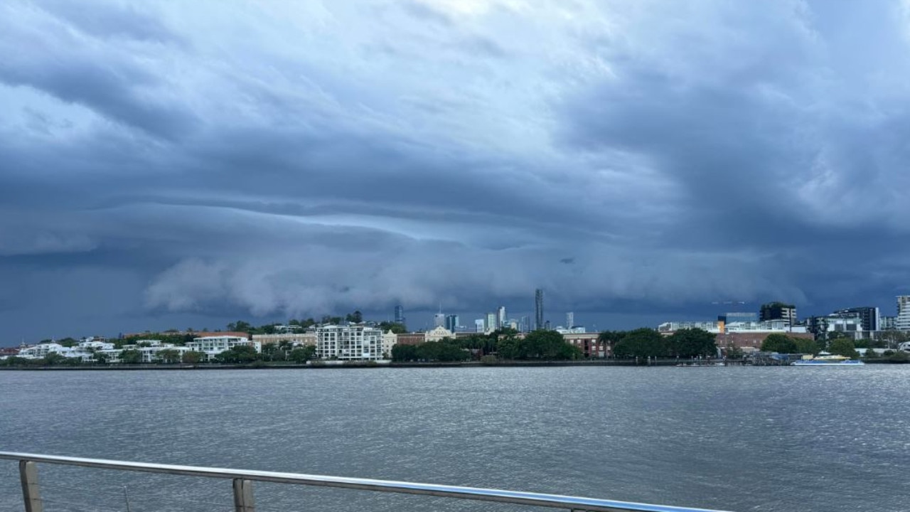 Tuesday's storm rolling in over the Brisbane River. Credit: Peter Holland