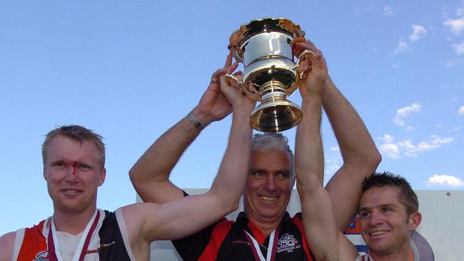 The winning Morningside coach John Blair, middle, with captain David Lillico and Paul Wessling.