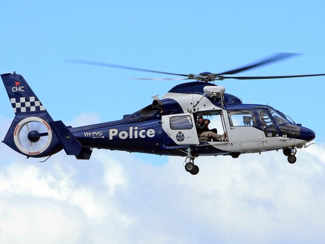 05/10/17 A search and rescue helicopter joins the search as  Police and volunteers search the cliffs close to the the holiday house of missing mum Elisa Curry in Aireys Inlet on the Great Ocean Road. Aaron Francis/The Australian