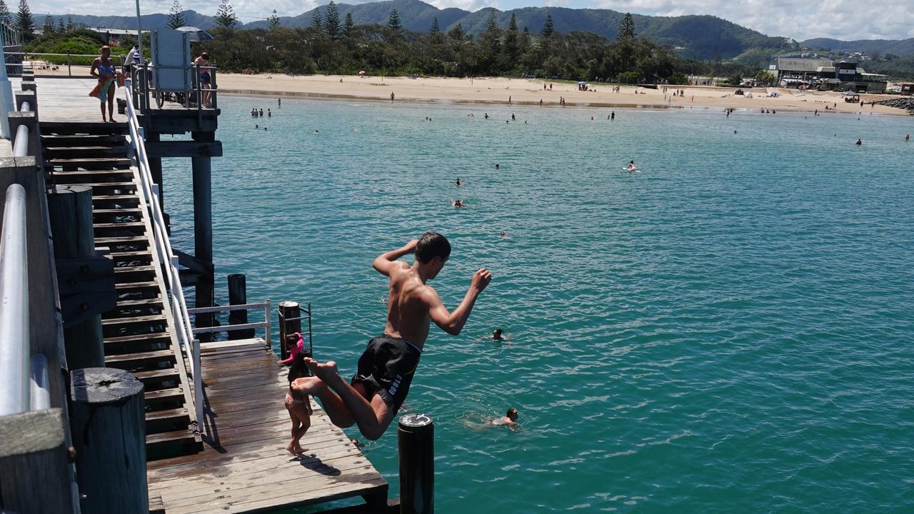 Jaden Coombes from Arrawarra takes the plunge. Picture: Chris Knight